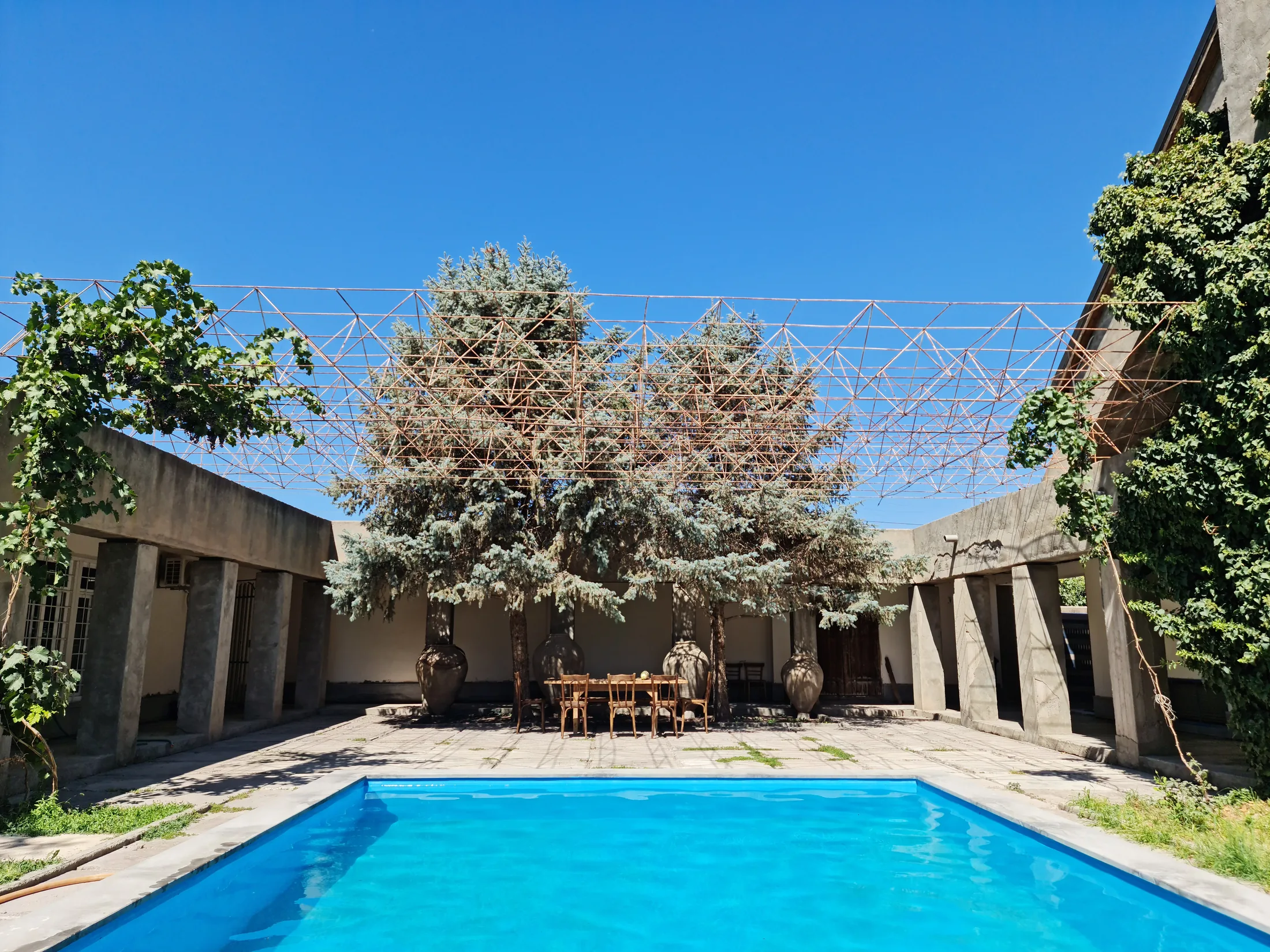 The winery courtyard with the tasting table, clay karas and pool